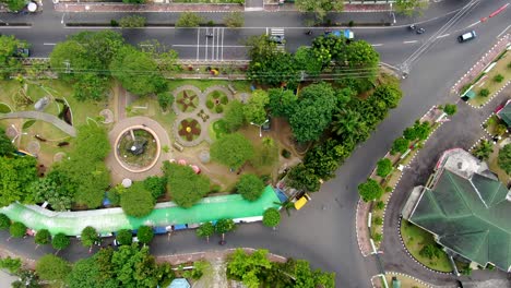 Beautiful-green-vibrant-park-in-Magelang-city,-aerial-top-down-view