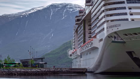 Large-white-cruiseship-docking-at-Flam-wharf,-departure-of-tourist-in-Norway,-Sognefjord