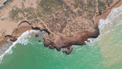 Turquoise-Waves-Breaking-Against-Rugged-Balochistan-Coastline