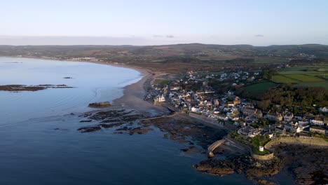 Stunning-aerial-panoramic-view-of-Marazion-village-and-St-Michaels-Mount-during-high-tide,-Cornwall