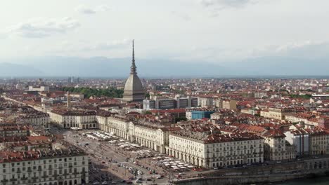 Mole-Antonelliana-building-of-Turin-city-and-majestic-cityscape,-aerial-drone-view