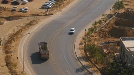 Curved-Road-With-Empty-Lorry-Driving-Past-At-Bahria-Housing-Estate