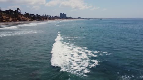 A-surfer-catches-a-wave-on-a-beautifully-sunny-San-Diego-day