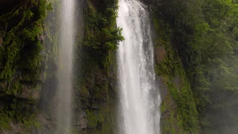 Camera-pans-down-the-powerful-Nauyaca-Waterfall-in-Costa-Rica-in-slow-motion