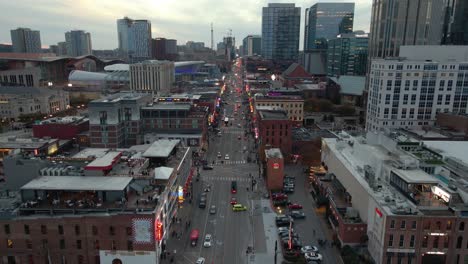 Aerial-view-overlooking-the-famous-Broadway-street-in-Nashville,-USA---rising,-drone-shot