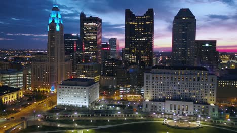 Aerial-drone-view-towards-high-rise-in-downtown-Columbus,-twilight-in-Ohio,-USA