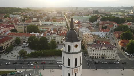 AERIAL:-Vilnius-Old-Town-Panorama-with-Bell-Tower-in-Foreground-on-a-Sunny-Summer-Evening
