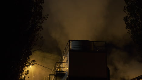 Industrial-pollution-smoke-from-factory-at-night,-industry-chemical-toxic-gas,-environmental-danger,-global-warming,-steam-smog-from-chimney