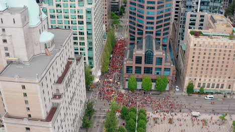 Circling-drone-overhead-view-of-the-Cancel-Canada-Day-Protest-March-in-Vancouver-BC-Canada