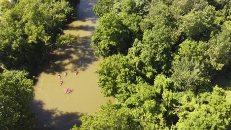Kayakers-Going-Down-Huron-River-Near-Flat-Rock-In-Southeast-Michigan---aerial-drone-shot