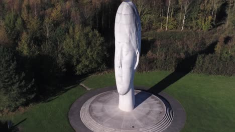 The-Dream-sculpture-Bold-forest-landmark-face-obelisk-statue-aerial-view-St-Helens-zoom-out-reveal