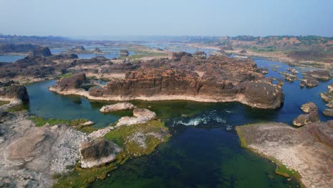 Drone-shot-over-Narmada-river-water-flowing-in-Vadodara,-Gujrat,-India-at-bright-sunny-day