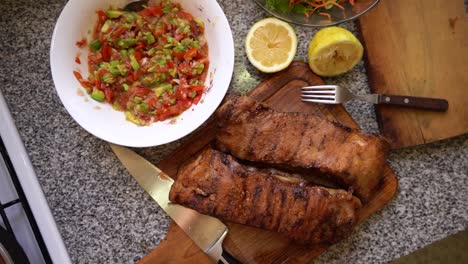 Top-view-of-typical-argentinean-food,-grilled-meat-with-salads