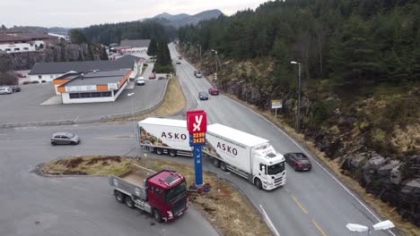 Extreme-fuel-prices-in-Norway-during-crisis-between-Russia-and-Ukraine---Billboard-showing-prices-passing-24-nok-or-3-dollars-pr-liter---Slow-aerial-orbit-around-price-billboard-from-YX-fuel-station