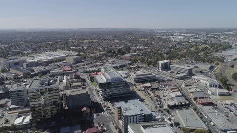 Impressive-aerial-perspective-of-inner-Dandenong-City-flying-over-new-and-old-developments-on-summers-day