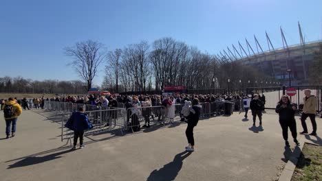 Large-group-of-Ukrainian-Refugees-reception-on-PGE-Narodowy-Stadium-entrance-in-Warsaw