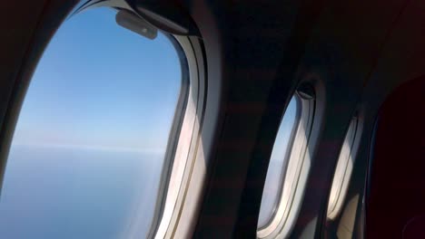Sky-seen-from-inside-windows-in-an-airplane