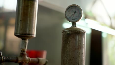 Closeup-Shot-Of-A-Industrial-Machine-Air-Pressure-Gauge-In-A-Manufacturing-Plant