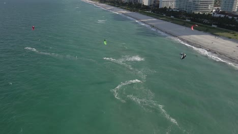 Aerial:-Kite-surfers-ride-onshore-wind-on-sunny-Miami-Beach-afternoon