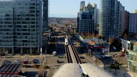 Metro-Vancouver-Skytrain-On-Railway-Approaching-Station
