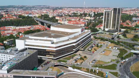 Building-of-Prague-Congress-Centre,-aerial-drone-static-or-steady-view-from-far,-traffic-in-background