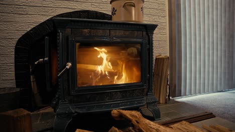 A-fire-burning-in-a-wood-stove-on-a-cold-winter-day