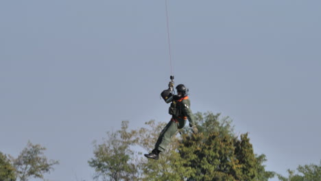 Winchman-lifted-rescued-from-hospital-helicopter-of-Italian-Air-Force-during-a-public-performance-demonstration-of-emergency-alert-call
