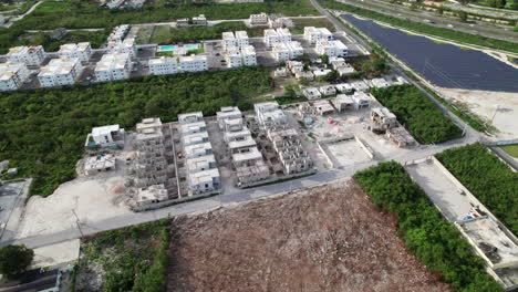 Aerial-Shot-Flying-Over-New-Build-Condominiums-Being-Constructed-In-Punta-Cana,-Dominican-Republic