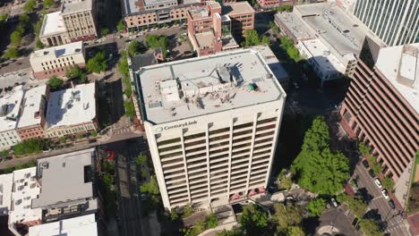Lowering-aerial-shot-revealing-the-CenturyLink-headquarter-building,-providing-internet-for-America