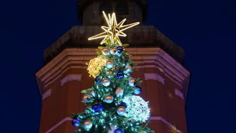 Christmas-tree-top-with-Bethlehem-Star-and-glittering-ornaments,-holiday-season
