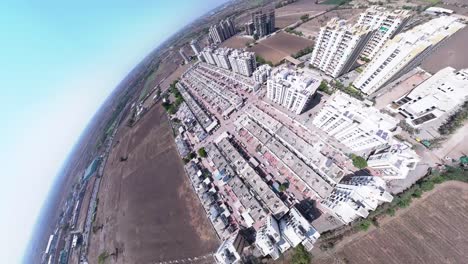 Aerial-drone-fly-over-cityscape-architecture-street-in-Gujarat,-rajkot,-india,-car-buildings-in-sunny-urban-day,-outdoors-transportation-community