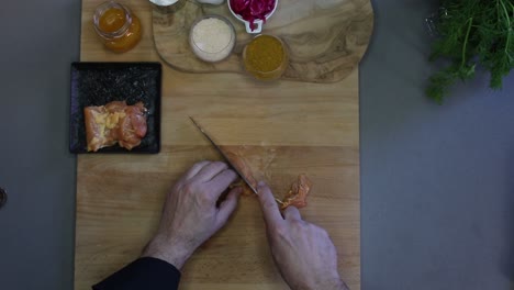 Cutting-chicken-before-cooking-in-the-kitchen