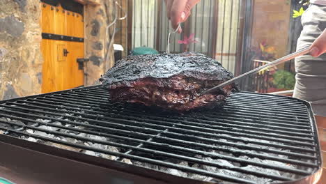 slow-motion-scene-of-juicy-cut-of-Argentinian-meat-on-the-grill