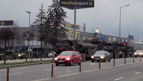American-Military-Convoy-Stops-at-Local-Mall-in-City-Center,-Poland