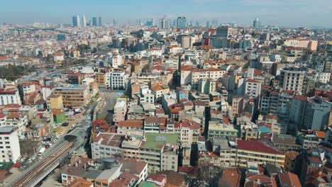 Aerial-drone-forwarding-shot-over-city-of-Istanbul,-Turkey-as-residential-and-office-buildings-at-daytime