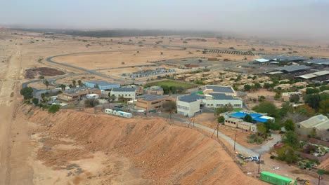 High-aerial-view-of-Kibbutz-Yotvata,-southern-Arava,-Israel-showing-modern-buildings
