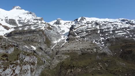Mountain-summits-and-valley-with-snow-during-winter