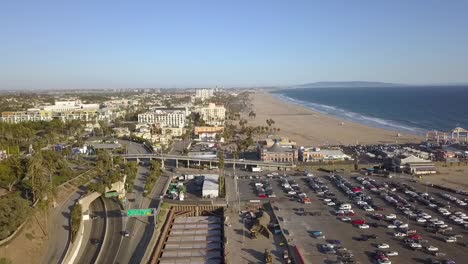 1-million-$-aerial-view-flight-drone-footage-of-Santa-Monica-Pier,-daytime-no-clouds