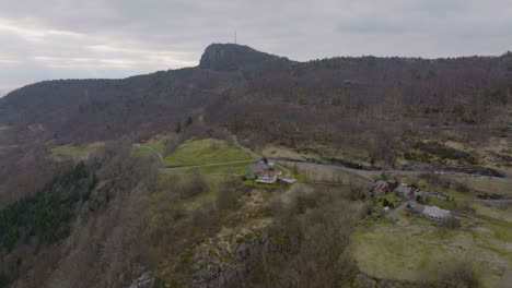 Aerial-view-of-a-small-and-rural-farm-in-the-countryside-of-Norway