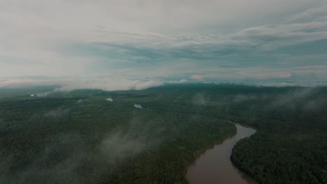 Slow-aerial-flyover-Amazon-River-and-green-Jungle-Landscape-of-Peru-during-cloudy-day,South-America