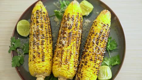 barbecue-and-grilled-corn-with-cheese-and-lime-on-plate