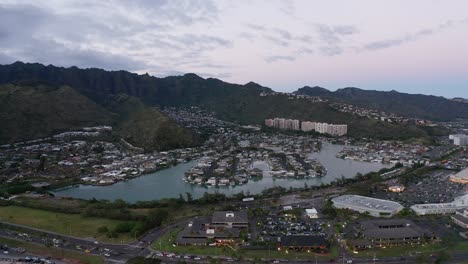 Wide-aerial-panning-shot-of-Hawaiian-suburbs-in-low-light-on-the-island-of-O'ahu,-Hawaii