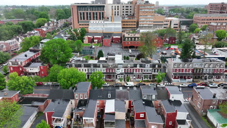 Aerial-descending-shot-of-houses-lining-city-streets