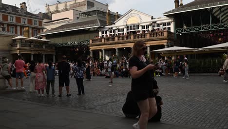 People-are-walking-through-Covent-Garden-in-front-of-the-beautiful-shops-that-are-available