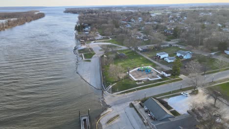 fast-aerial-spin-across-the-Illinois-River-and-riverfront-Chillicothe,-Illinois