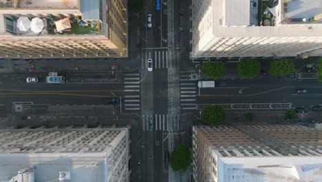 Birdseye-View-of-City-Intersection,-Downtown-Los-Angeles-Drone-Shot-of-Daytime-Traffic