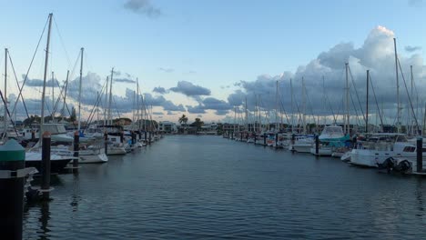 Marina-with-moored-yachts-and-small-boats-at-dusk