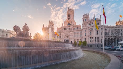 Early-morning-timelapse-of-Cibeles-fountain-and-Madrid-town-hall-with-traffic-and-beautiful-clouds-and-mornig-light