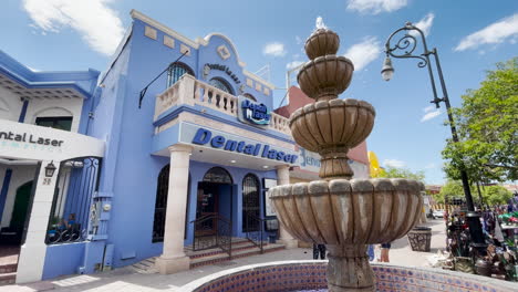 Colorful-dentist-office-and-water-fountain-in-Nogales,-a-Mexican-border-town