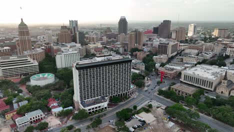 Cinematic-wide-aerial-of-San-Antonio-skyline-and-tourist-attractions-during-sunset